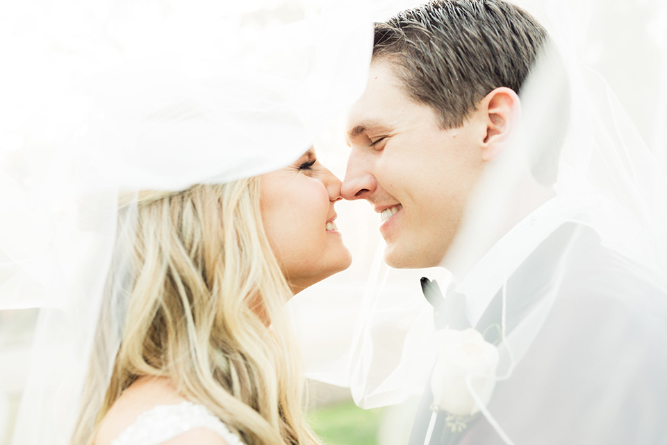 Autumn-inspired-wedding-at-coto-valley-country-club-bride-and-groom-kissing-under-veil