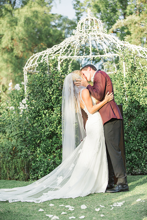 Autumn-inspired-wedding-at-coto-valley-country-club-ceremony-bride-and-groom-kissing