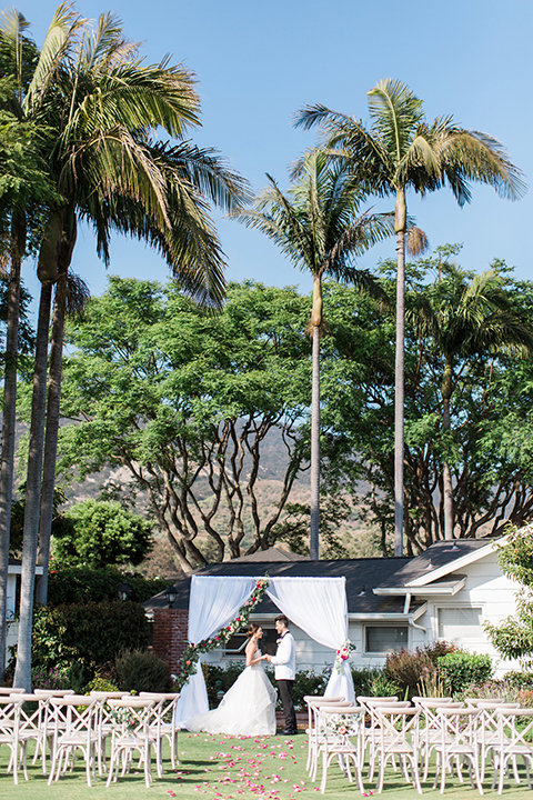 Santa-barbara-outdoor-wedding-bride-and-groom-ceremony-holding-hands