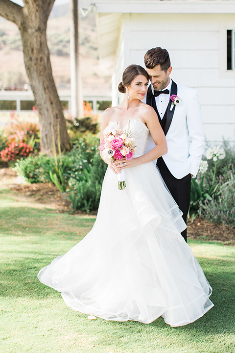 Santa-barbara-outdoor-wedding-bride-and-groom-hugging-and-smiling