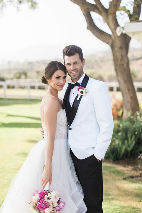 Santa-barbara-outdoor-wedding-bride-and-groom-hugging-smiling