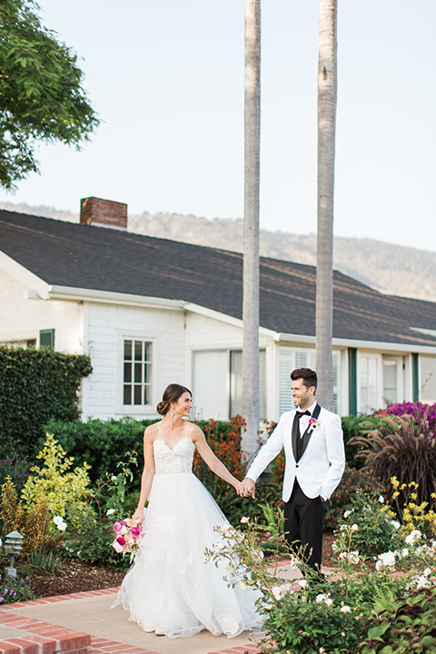 Santa-barbara-outdoor-wedding-bride-and-groom-standing-holding-hands