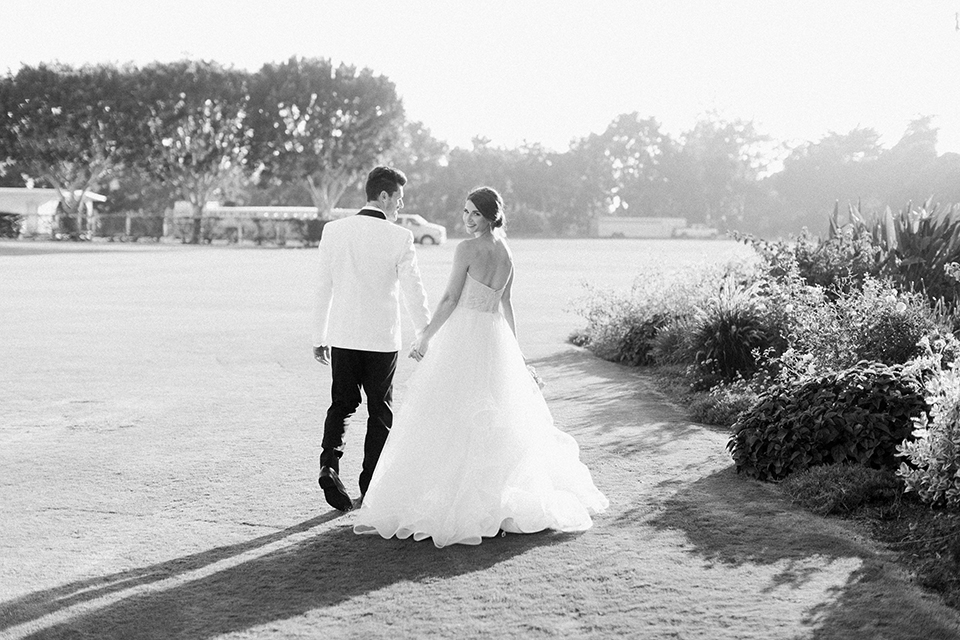 Santa-barbara-outdoor-wedding-bride-and-groom-walking-smiling