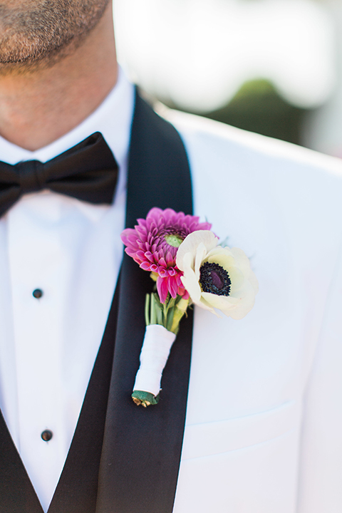 Santa-barbara-outdoor-wedding-groom-white-tuxedo-close-up-boutonniere