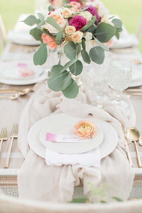 Santa-barbara-outdoor-wedding-table-set-up-with-flowers-and-place-settings