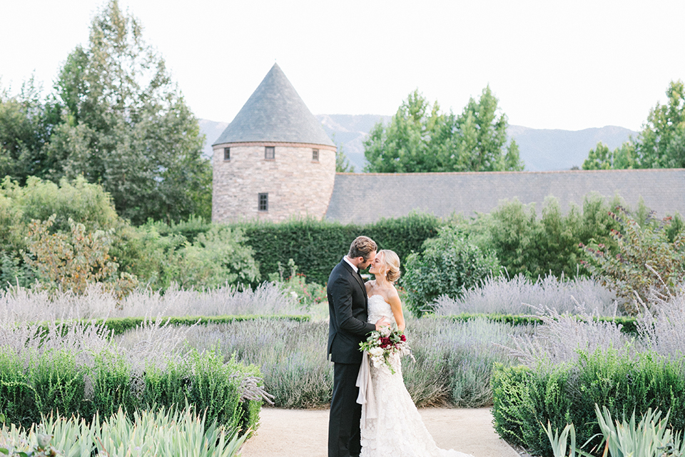 Santa-barbara-outdoor-wedding-at-kestrel-park-bride-and-groom-holding-hands-kissing