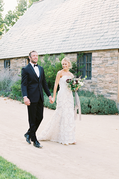 Santa-barbara-outdoor-wedding-at-kestrel-park-bride-and-groom-holding-hands