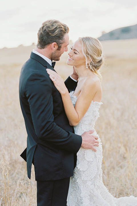 Santa-barbara-outdoor-wedding-at-kestrel-park-bride-and-groom-standing-hugging-close-up