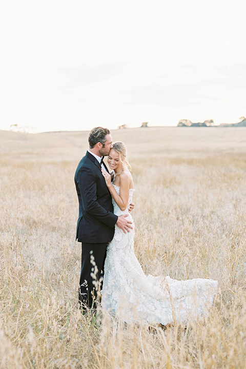 Santa-barbara-outdoor-wedding-at-kestrel-park-bride-and-groom-standing-hugging