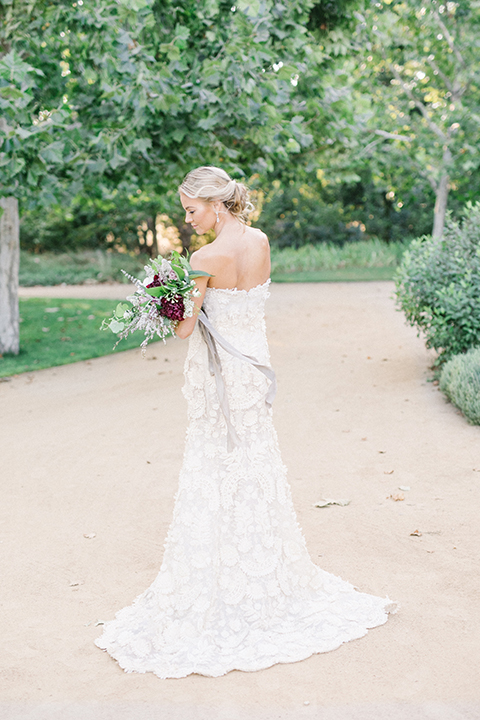 Santa-barbara-outdoor-wedding-at-kestrel-park-bride-holding-bouquet