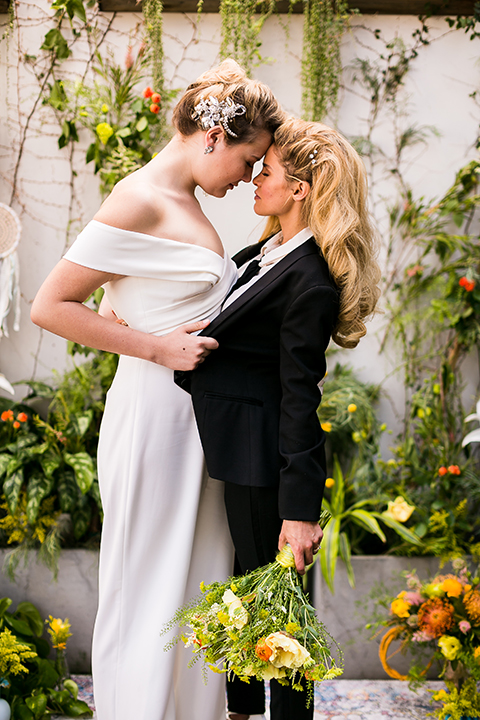 Lesbian-wedding-shoot-at-madera-kitchen-brides-hugging-close-up