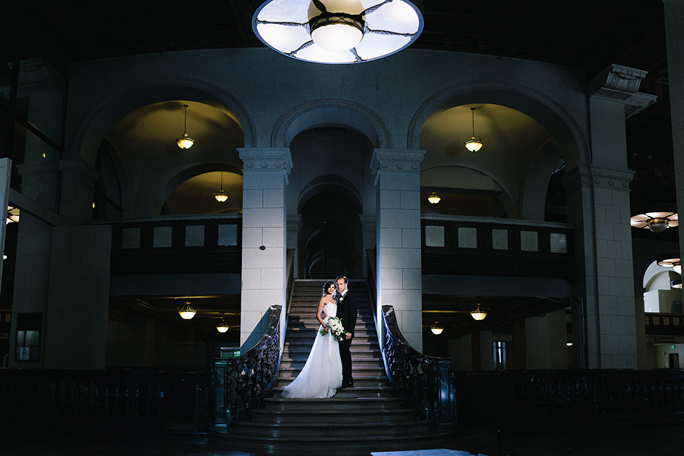 Los-angeles-wedding-at-the-majestic-bride-and-groom-standing-on-stairs-smiling