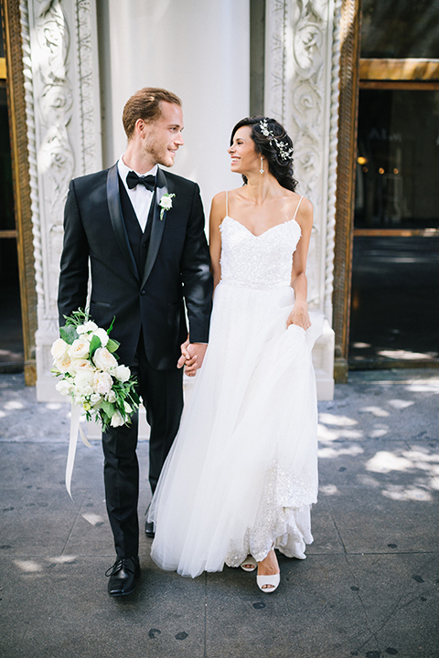 Los-angeles-wedding-at-the-majestic-bride-and-groom-walking-holding-hands