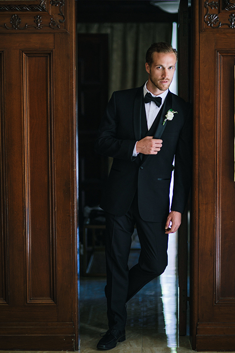 Los-angeles-wedding-at-the-majestic-groom-black-tuxedo-standing