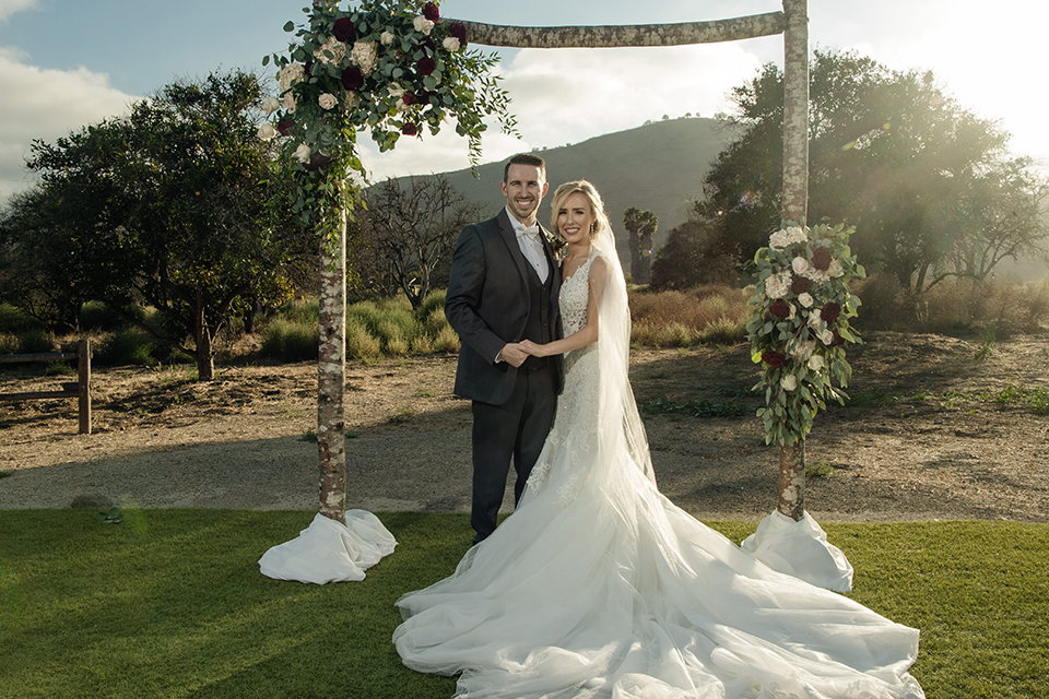 Orange-county-wedding-at-the-hamilton-oaks-winery-bride-and-groom-hugging-and-holding-hands