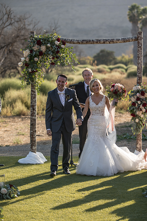 Orange-county-wedding-at-the-hamilton-oaks-winery-ceremony-bride-and-groom-holding-hands