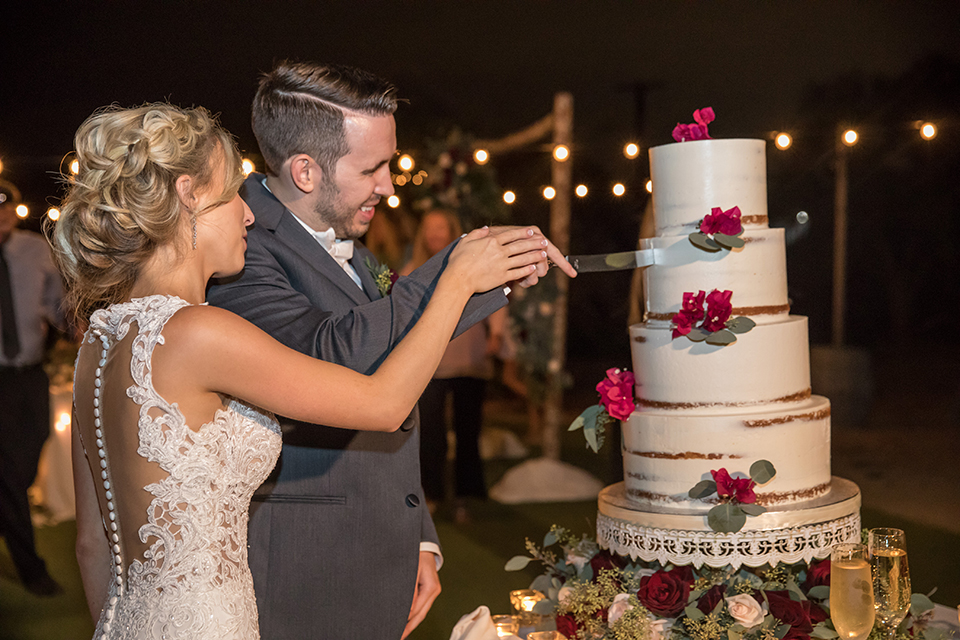 Orange-county-wedding-at-the-hamilton-oaks-winery-reception-bride-and-groom-cutting-cake