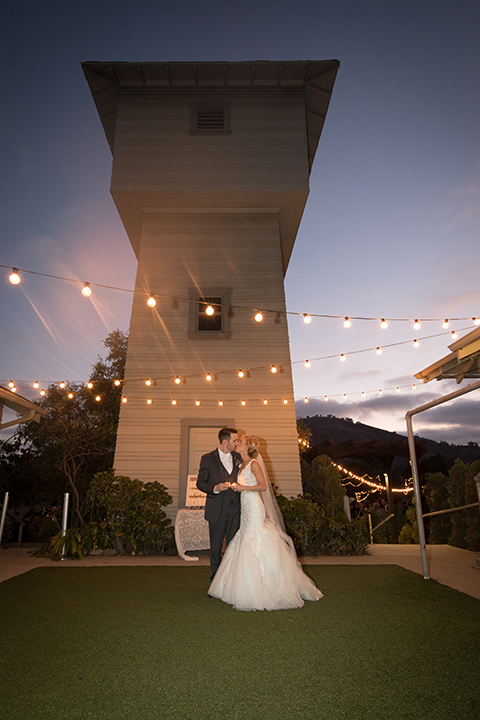 Orange-county-wedding-at-the-hamilton-oaks-winery-reception-bride-and-groom-kissing