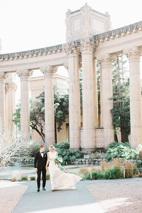 San-francisco-palace-wedding-shoot-bride-and-groom-holding-hands-far-away