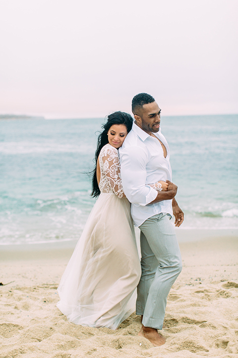 Orange-county-beach-wedding-in-dana-point-bride-and-groom-standing-and-hugging