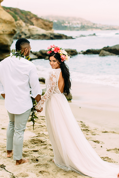 Orange-county-beach-wedding-in-dana-point-bride-and-groom-standing-holding-hands