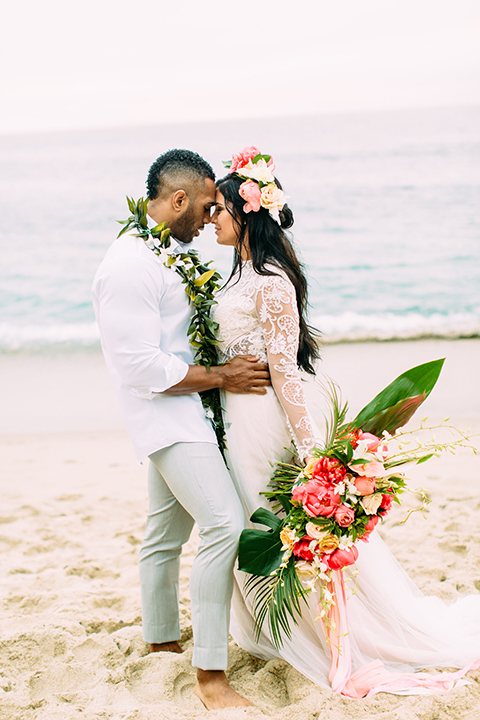 Orange-county-beach-wedding-in-dana-point-bride-and-groom-standing-hugging-close-up