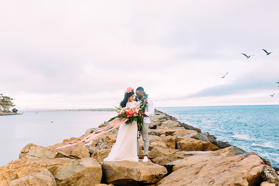 Orange-county-beach-wedding-in-dana-point-bride-and-groom-standing-hugging