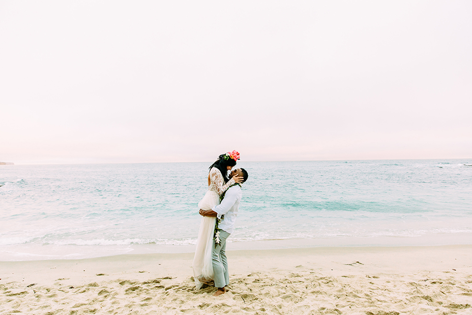 Orange-county-beach-wedding-in-dana-point-bride-and-groom-standing-kissing