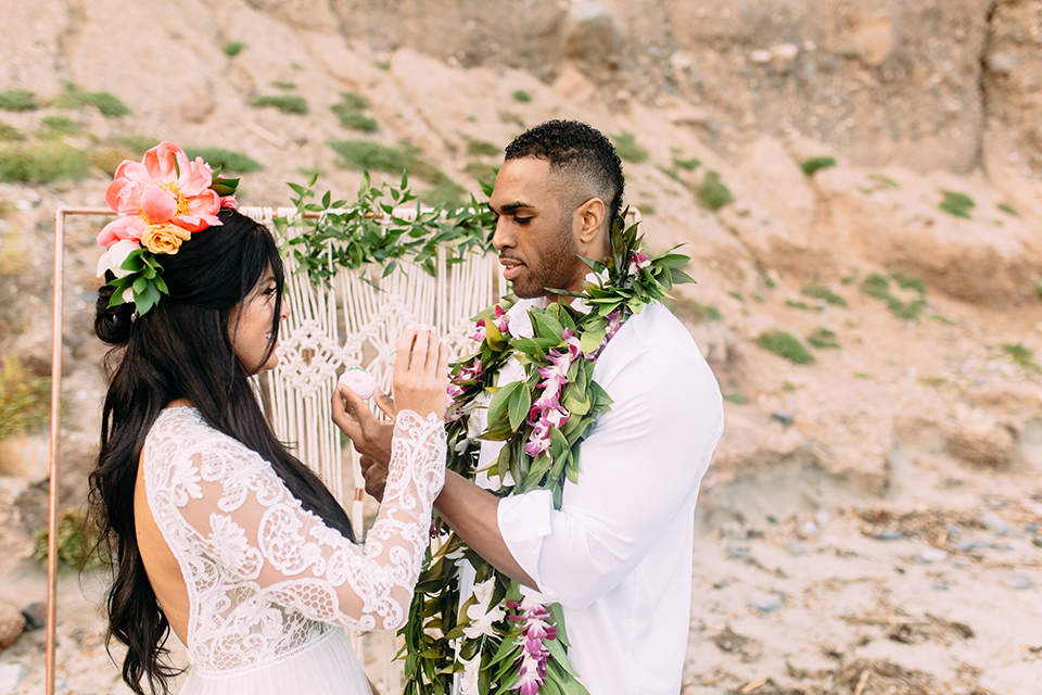 Orange-county-beach-wedding-in-dana-point-reception-bride-and-groom-eating-cake