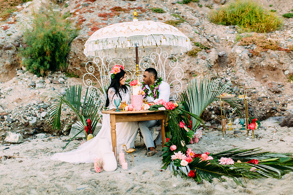 Orange-county-beach-wedding-in-dana-point-reception-bride-and-groom-sitting-at-table