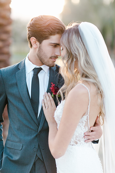 Palm-springs-wedding-shoot-at-old-polo-estate-bride-and-groom-holding-hands-close-up