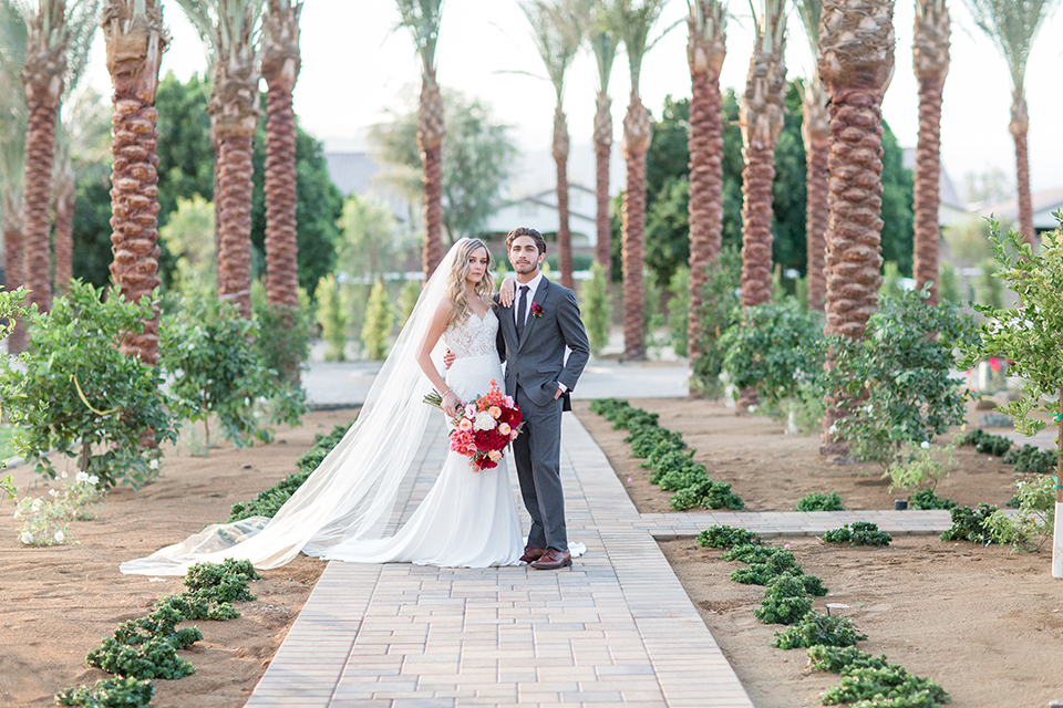 Palm-springs-wedding-shoot-at-old-polo-estate-bride-and-groom-hugging-and-smiling