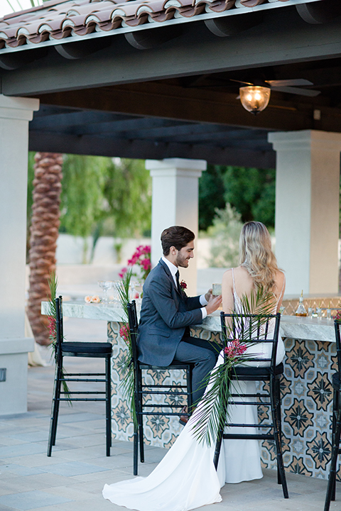 Palm-springs-wedding-shoot-at-old-polo-estate-bride-and-groom-sitting