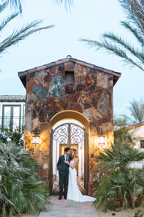 Palm-springs-wedding-shoot-at-old-polo-estate-bride-and-groom-standing-hugging