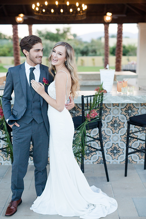 Palm-springs-wedding-shoot-at-old-polo-estate-bride-and-groom-standing-smiling