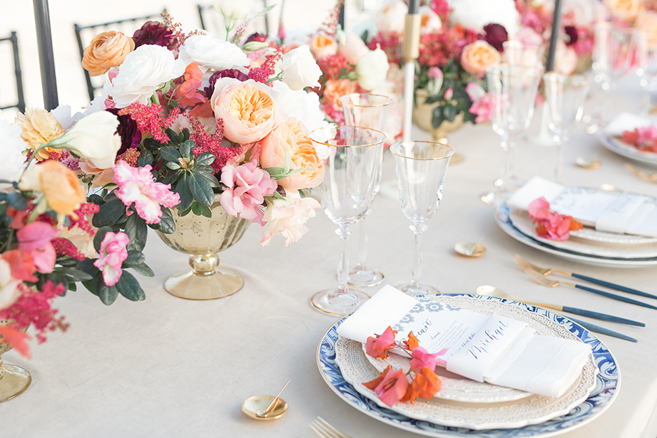 Palm-springs-wedding-shoot-at-old-polo-estate-table-set-up-with-place-settings-and-flowers