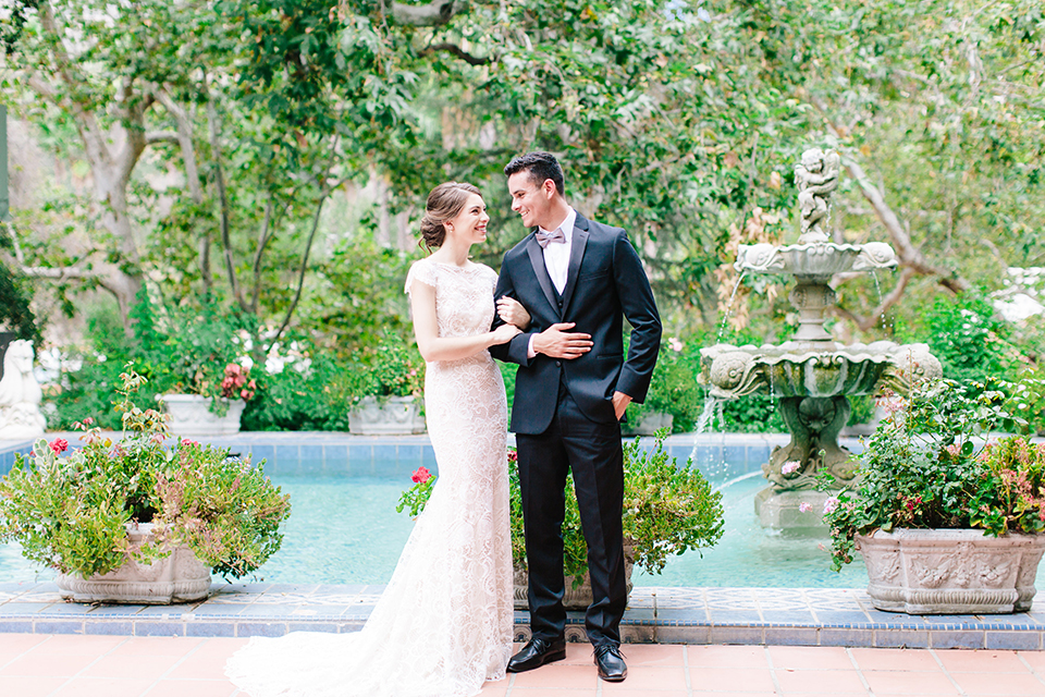 Rancho-las-lomas-outdoor-wedding-bride-and-groom-holding-arms