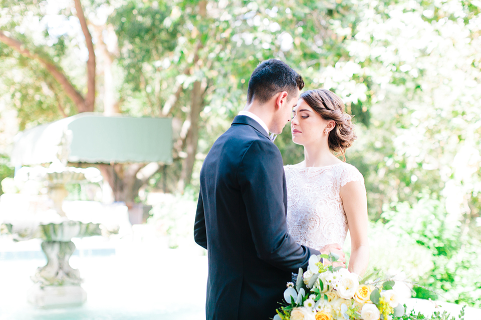 Rancho-las-lomas-outdoor-wedding-bride-and-groom-hugging-close-up