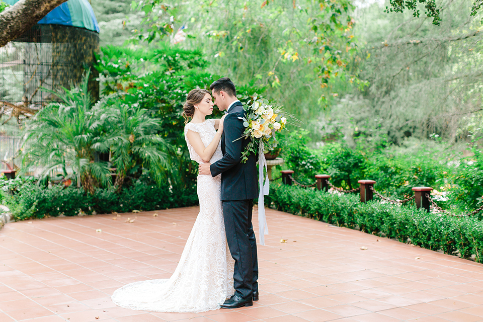 Rancho-las-lomas-outdoor-wedding-bride-and-groom-hugging-dancing