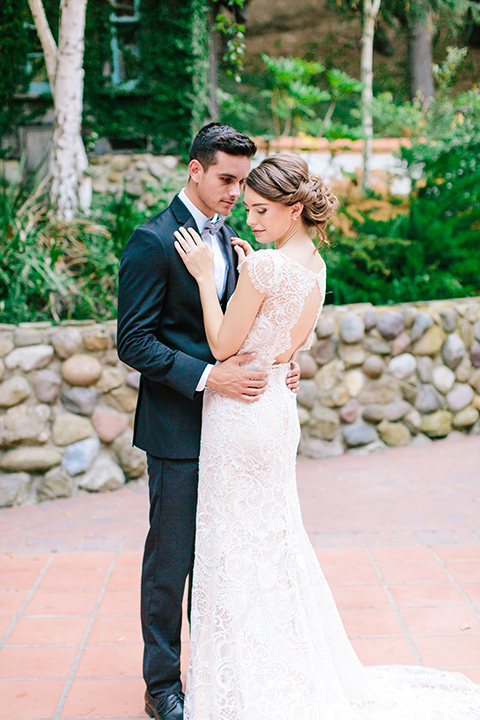 Rancho-las-lomas-outdoor-wedding-bride-and-groom-hugging-standing