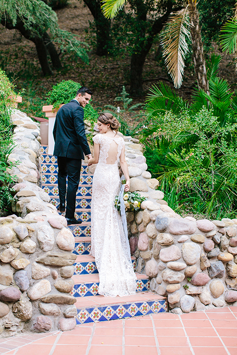 Rancho-las-lomas-outdoor-wedding-bride-and-groom-standing-and-walking-up-stairs