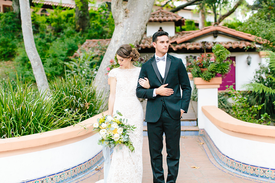 Rancho-las-lomas-outdoor-wedding-bride-and-groom-standing-holding-arms