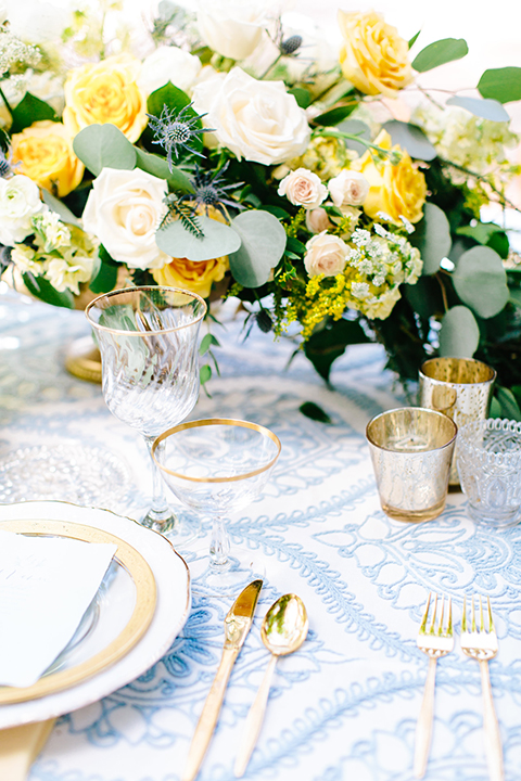 Rancho-las-lomas-outdoor-wedding-table-set-up-with-flowers-and-decor