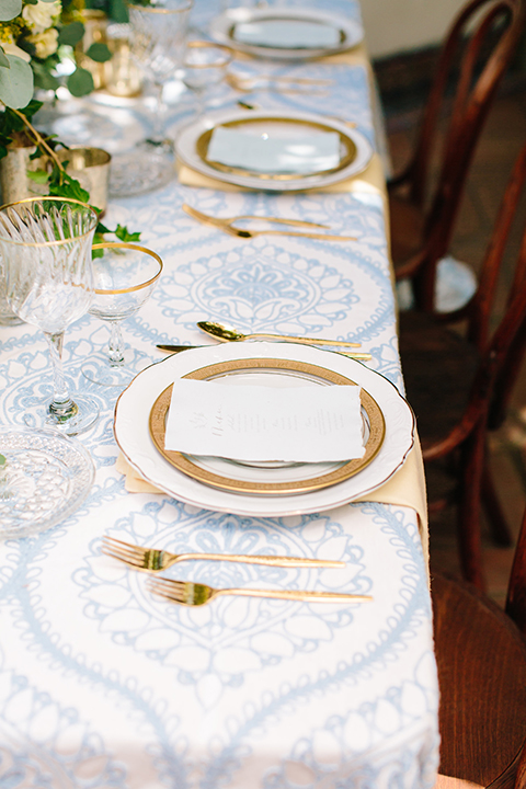 Rancho-las-lomas-outdoor-wedding-table-set-up-with-place-settings-and-chairs