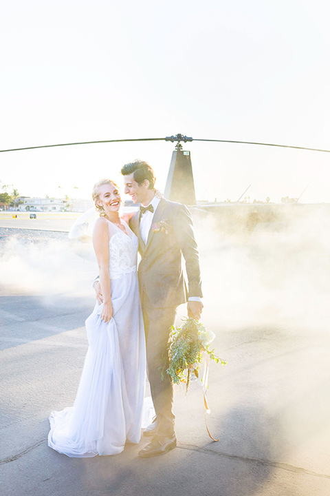 hangar-21-vertical-shot-of-bride-and-groom-by-helicopter