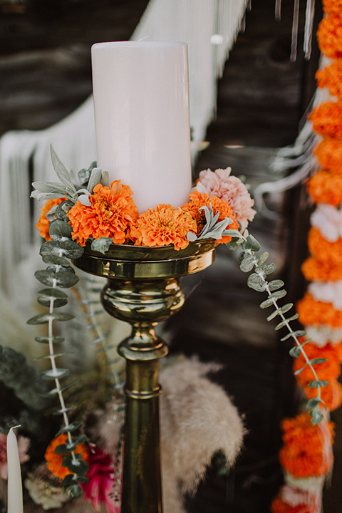 hey-babe-ranch-candles-bride-in-a-bohemian-gown-with-lace-and-fringe-detailing-and-hair-in-a-loose-wave-groom-in-a-burgundy-tuxedo-with-black-satin-truim-and-his-tie-undone-for-a-relaxed-look