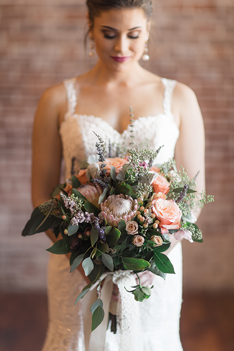 Orange-county-whimsical-wedding-at-franciscan-gardens-bride-holding-bouquet