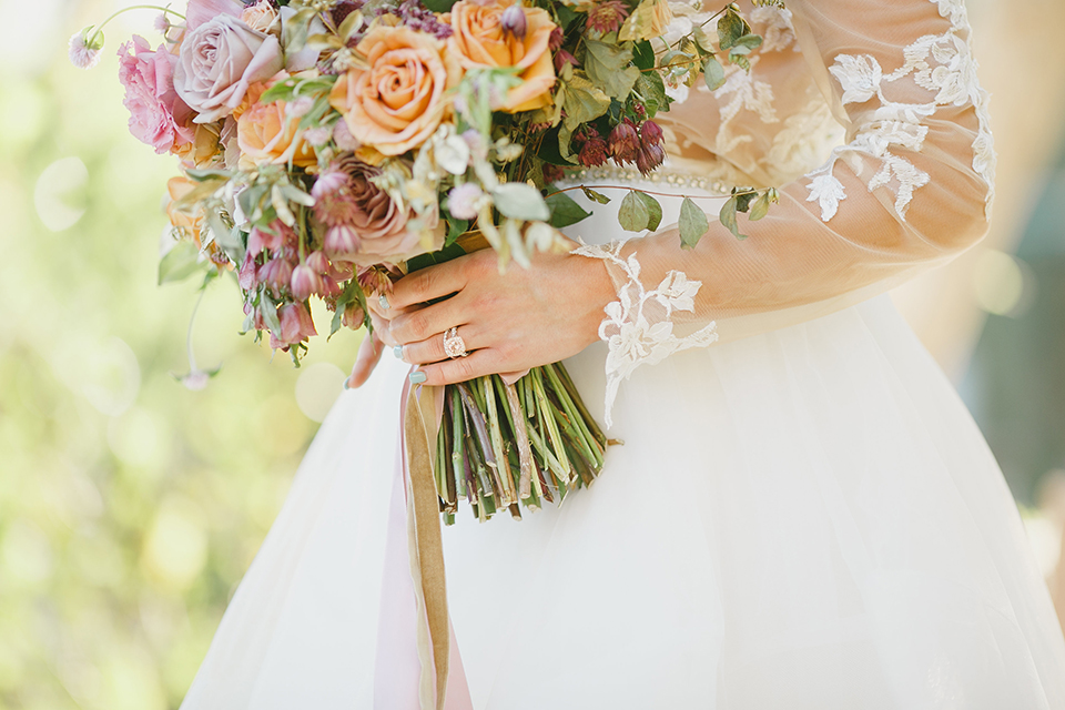 Temecula-outdoor-romantic-wedding-at-humphreys-estate-bride-holding-bouquet-close-up