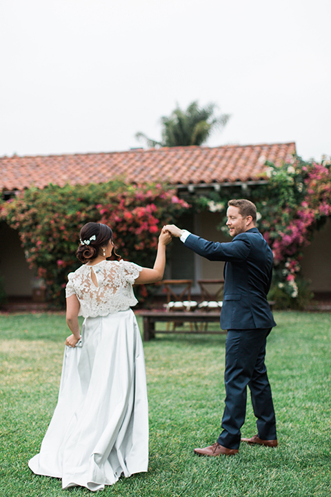 San-diego-outdoor-wedding-at-the-inn-at-rancho-santa-fe-bride-and-groom-holding-hands-and-dancing