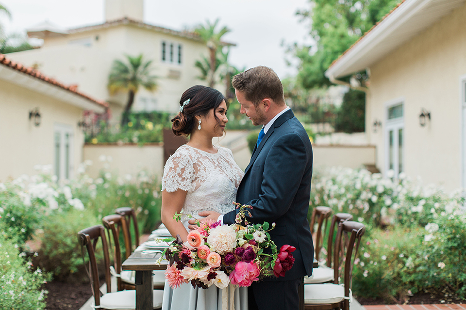 San-diego-outdoor-wedding-at-the-inn-at-rancho-santa-fe-bride-and-groom-standing-by-table